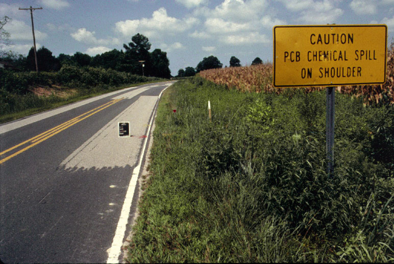 PCB warning sign from roadside dumping in piedmont NC